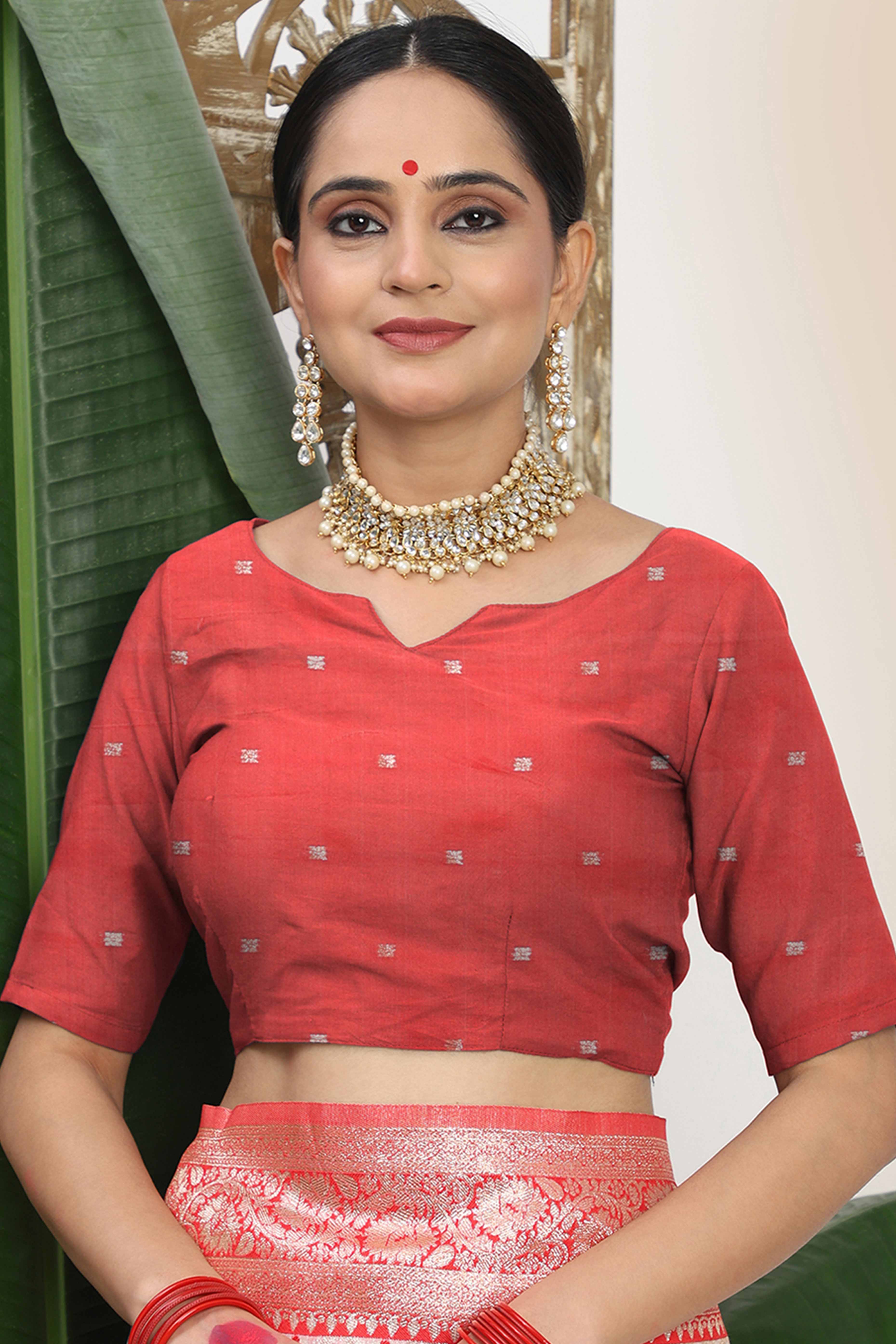 White & Red Linen Cotton Saree Accented With Rich Zari Weaving And A Decorative Tassel Pallu