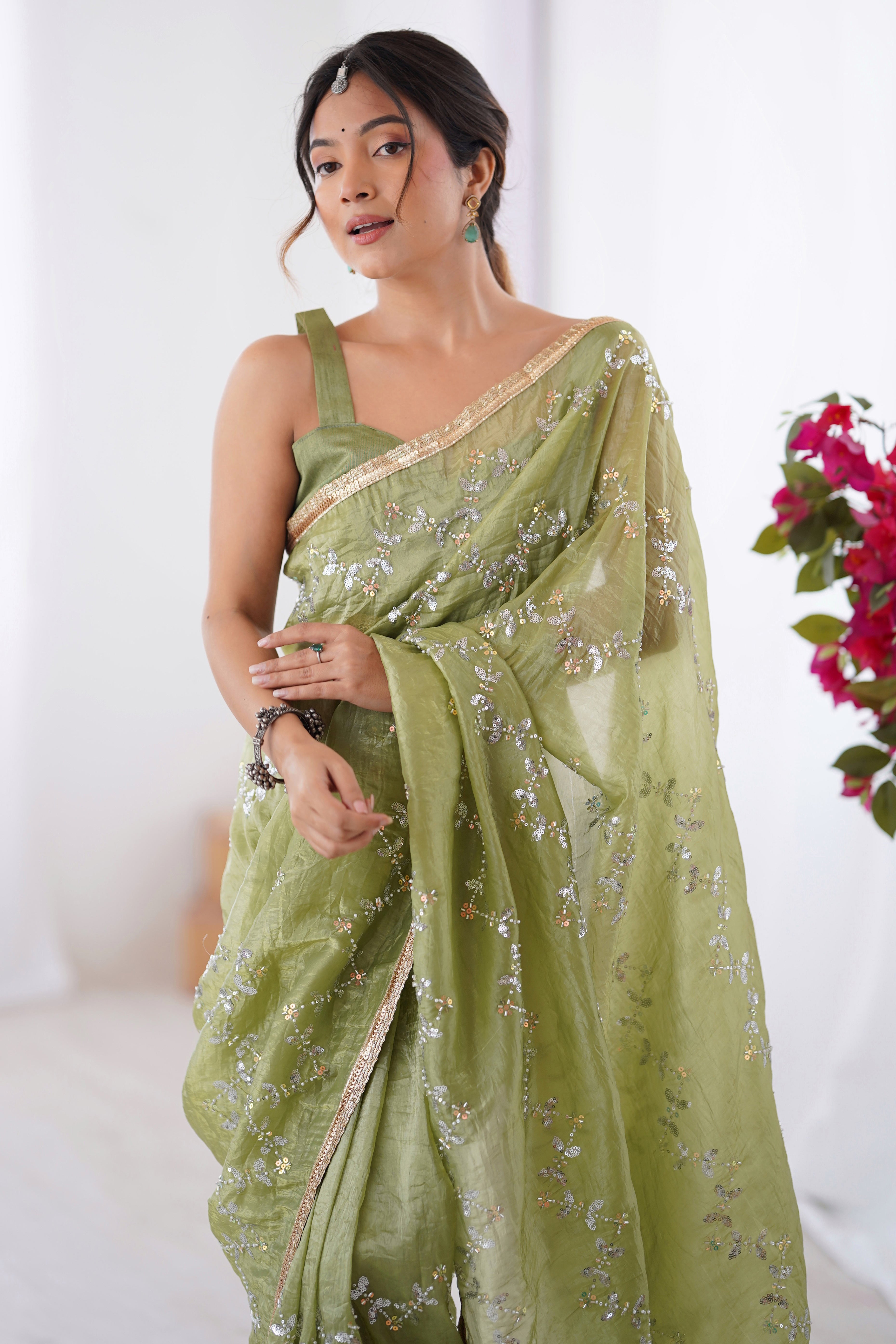 Dazzling Pista Green Organza Saree Accented with Sequin, Bead & Stone Work and Delicate Lace Detailing