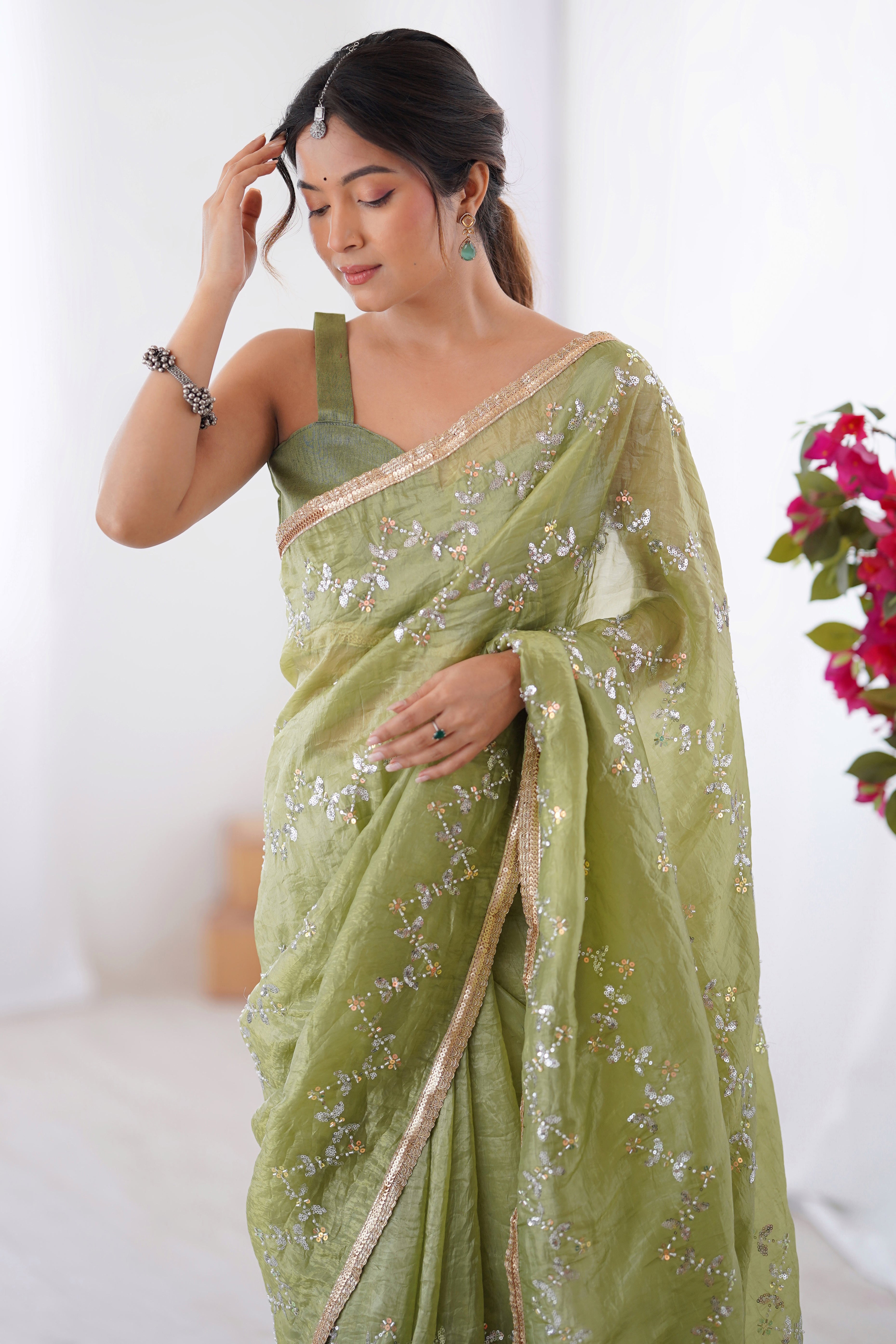 Dazzling Pista Green Organza Saree Accented with Sequin, Bead & Stone Work and Delicate Lace Detailing