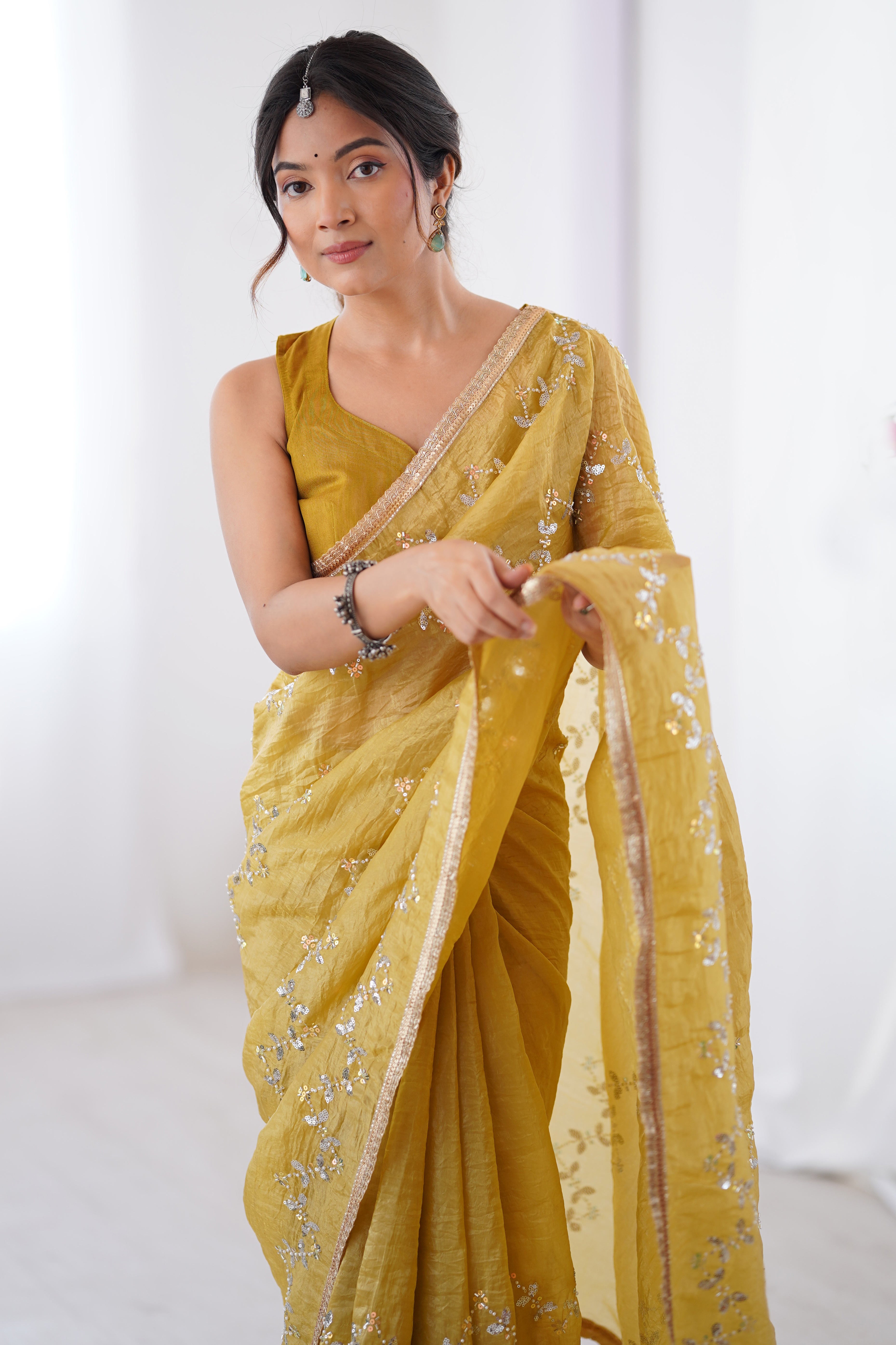 Dazzling Mustard Yellow Organza Saree Accented with Sequin, Bead & Stone Work and Delicate Lace Detailing