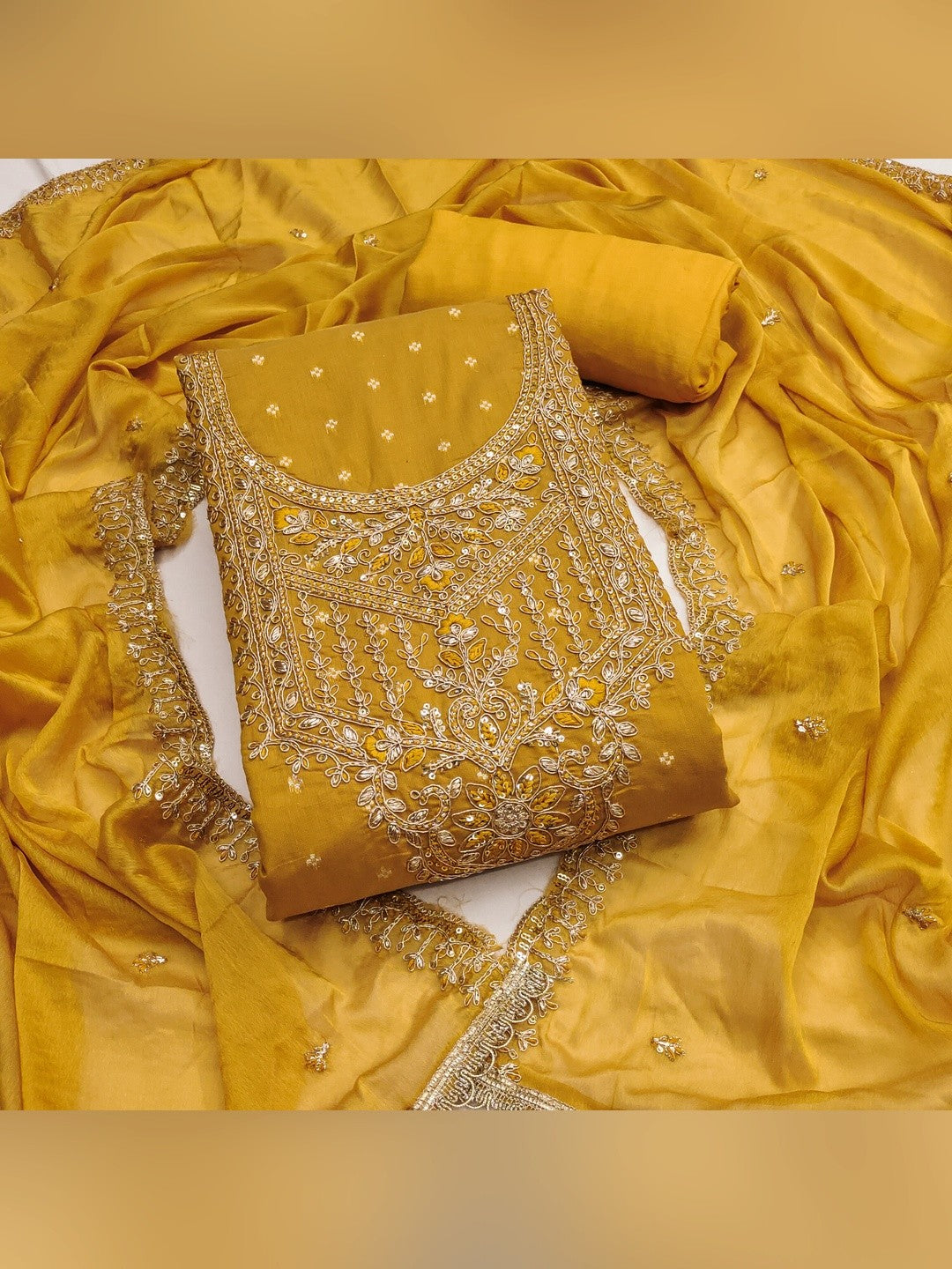 Premium Mustard Floral Chanderi Cotton Dress Material Adorned With Cording Embroidery & Sequins Work - Image 1