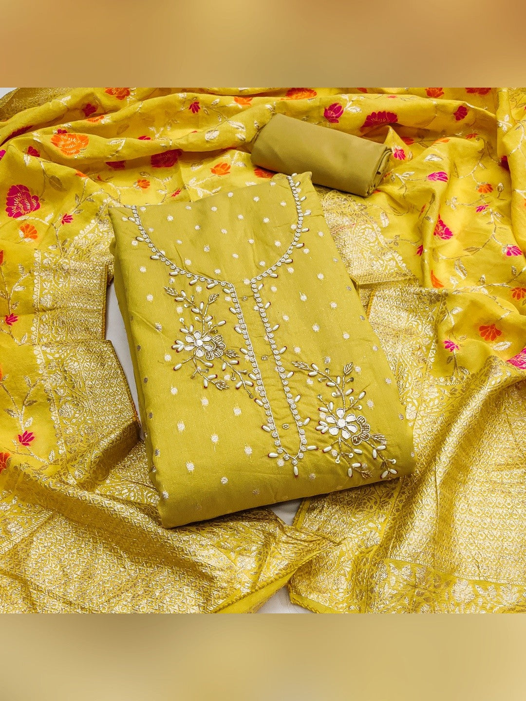 Elegant Mustard Weaving Shimmer Banarasi Dress Material Adorned With Floral Moti & Sequin Work - Image 1