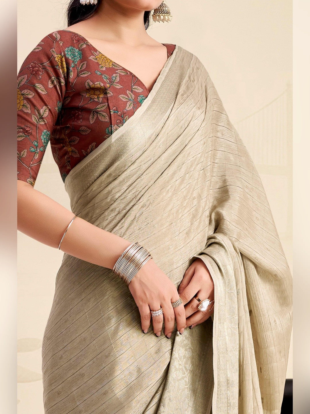 Refreshing Chikoo Floral Weaving Chinon Jacquard Saree With Artful Tassel Pallu Accent - Image 3