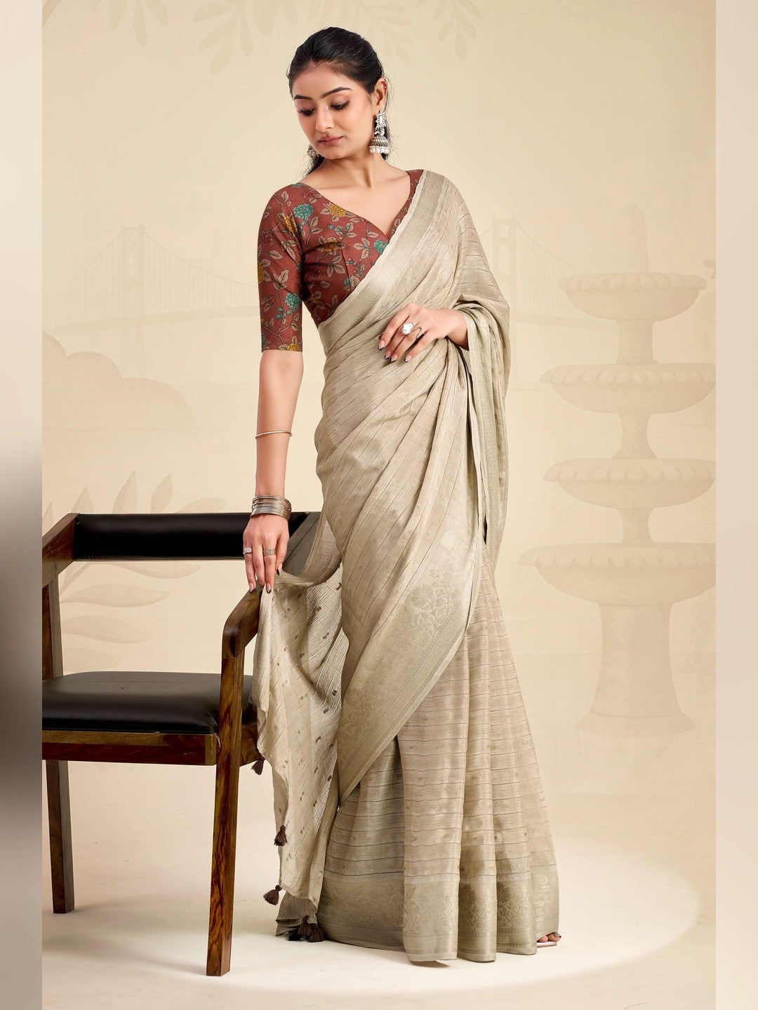 Refreshing Chikoo Floral Weaving Chinon Jacquard Saree With Artful Tassel Pallu Accent - Image 2