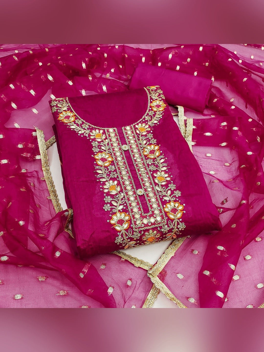 Rani Pink Chanderi Silk Dress Material Showcasing Floral Embroidery & Artisanal Gota Patti Work - Image 1