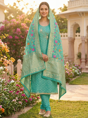 Elegant Turquoise Weaving Shimmer Banarasi Dress Material Adorned With Floral Moti & Sequin Work - Image 1
