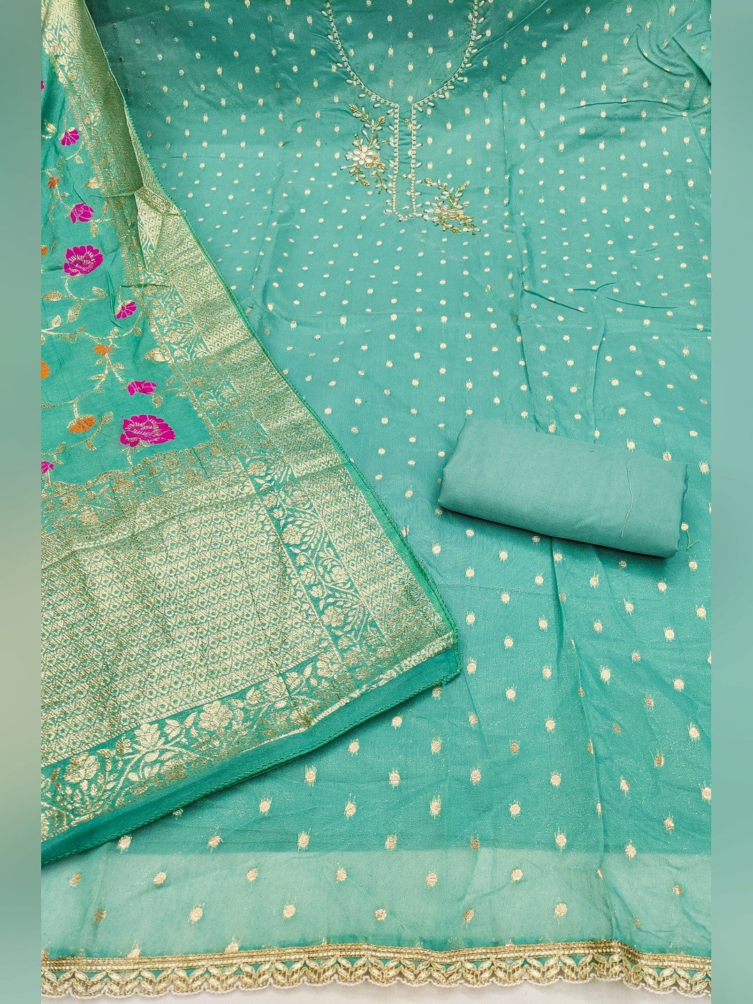 Elegant Turquoise Weaving Shimmer Banarasi Dress Material Adorned With Floral Moti & Sequin Work - Image 1