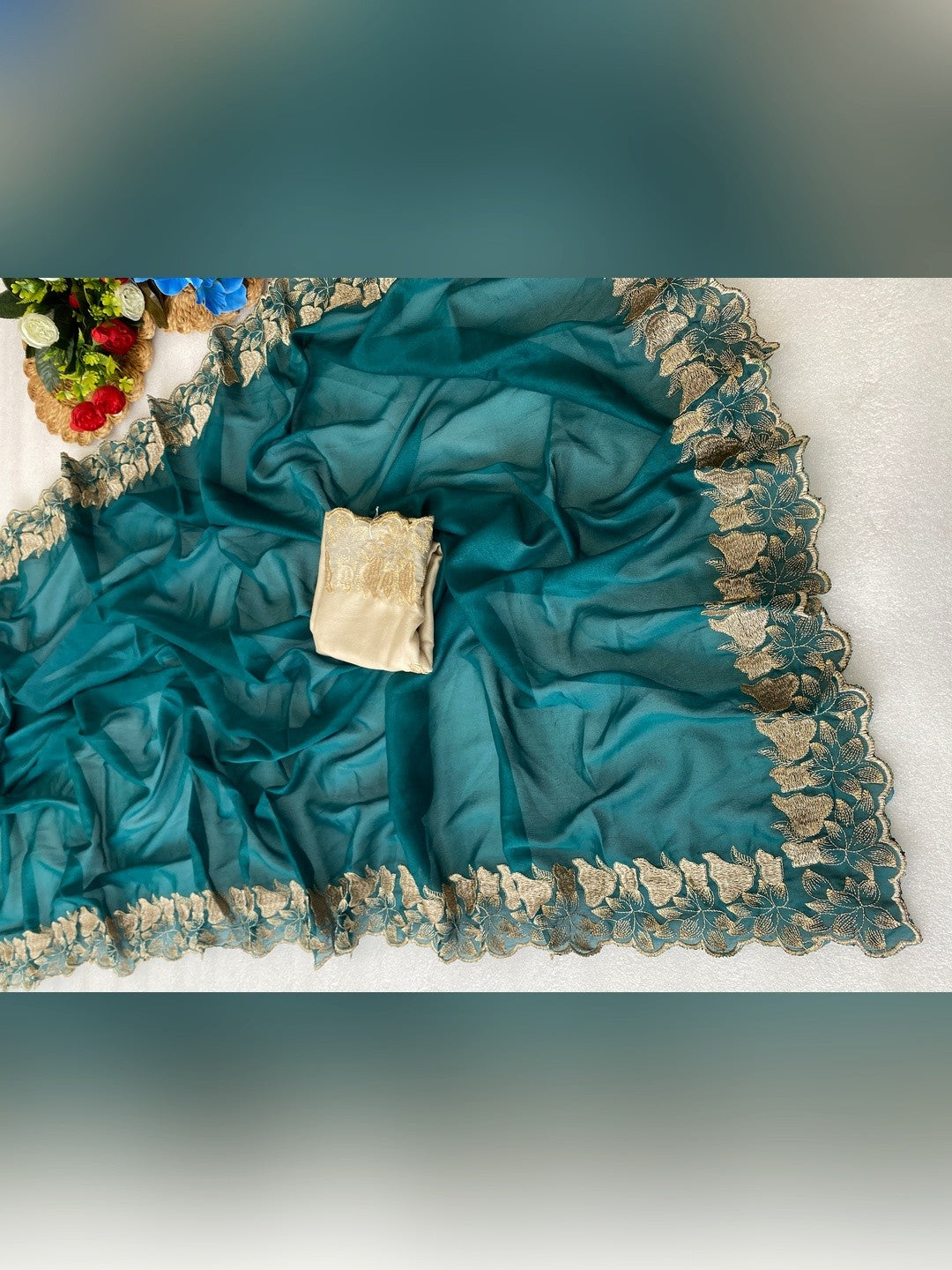Elegant Teal Solid Georgette Saree Highlighted With A Delicate Floral Embroidered Border - Image 3