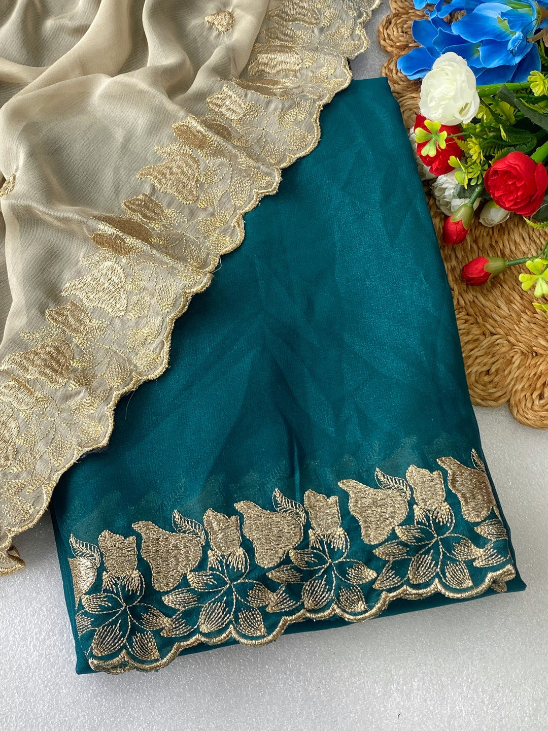 Elegant Teal Solid Georgette Saree Highlighted With A Delicate Floral Embroidered Border - Image 1