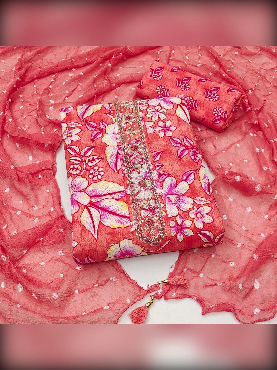 Stylish Coral Pink Floral Printed Pure Cotton Dress Material With Elegant Embroidered Neckline - Image 1