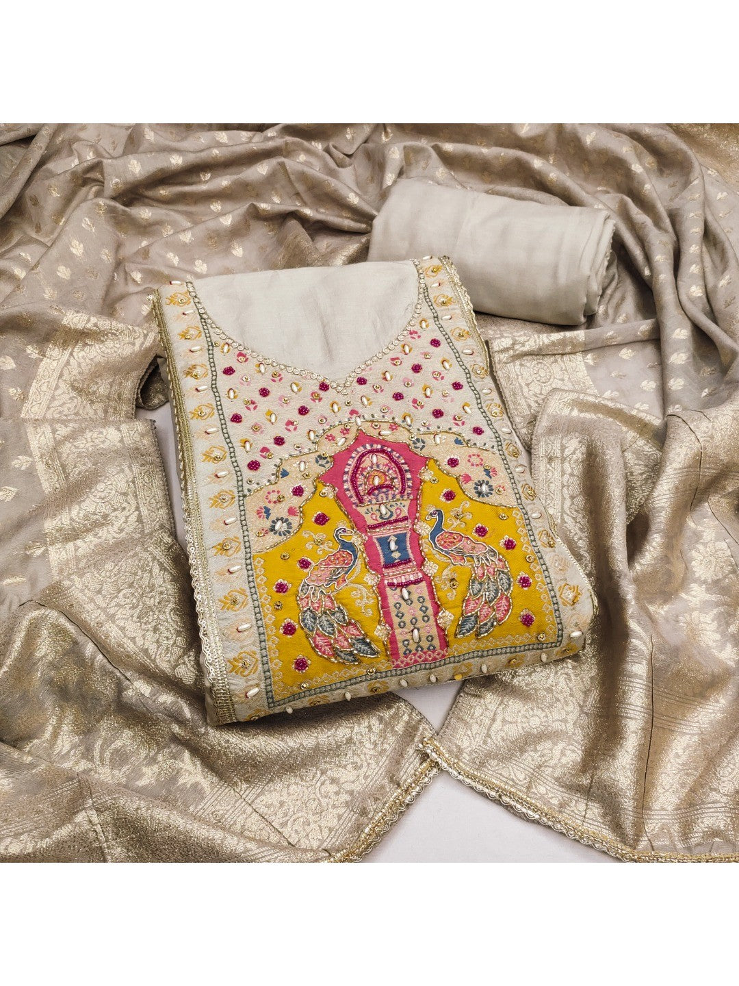 Graceful Chikoo Peacock Motif Cotton Silk Dress Material With Beads & Moti Handwork - Image 1