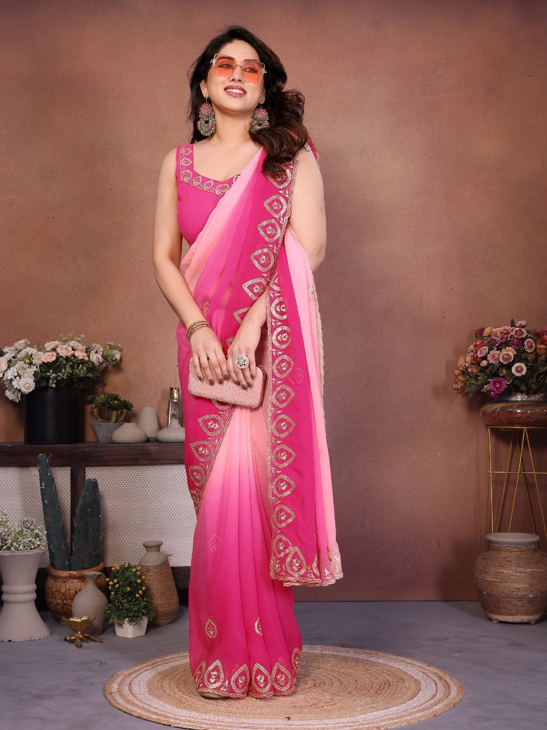 Pink Georgette Party Wear Saree with Designer Embroidered Border - Image 1