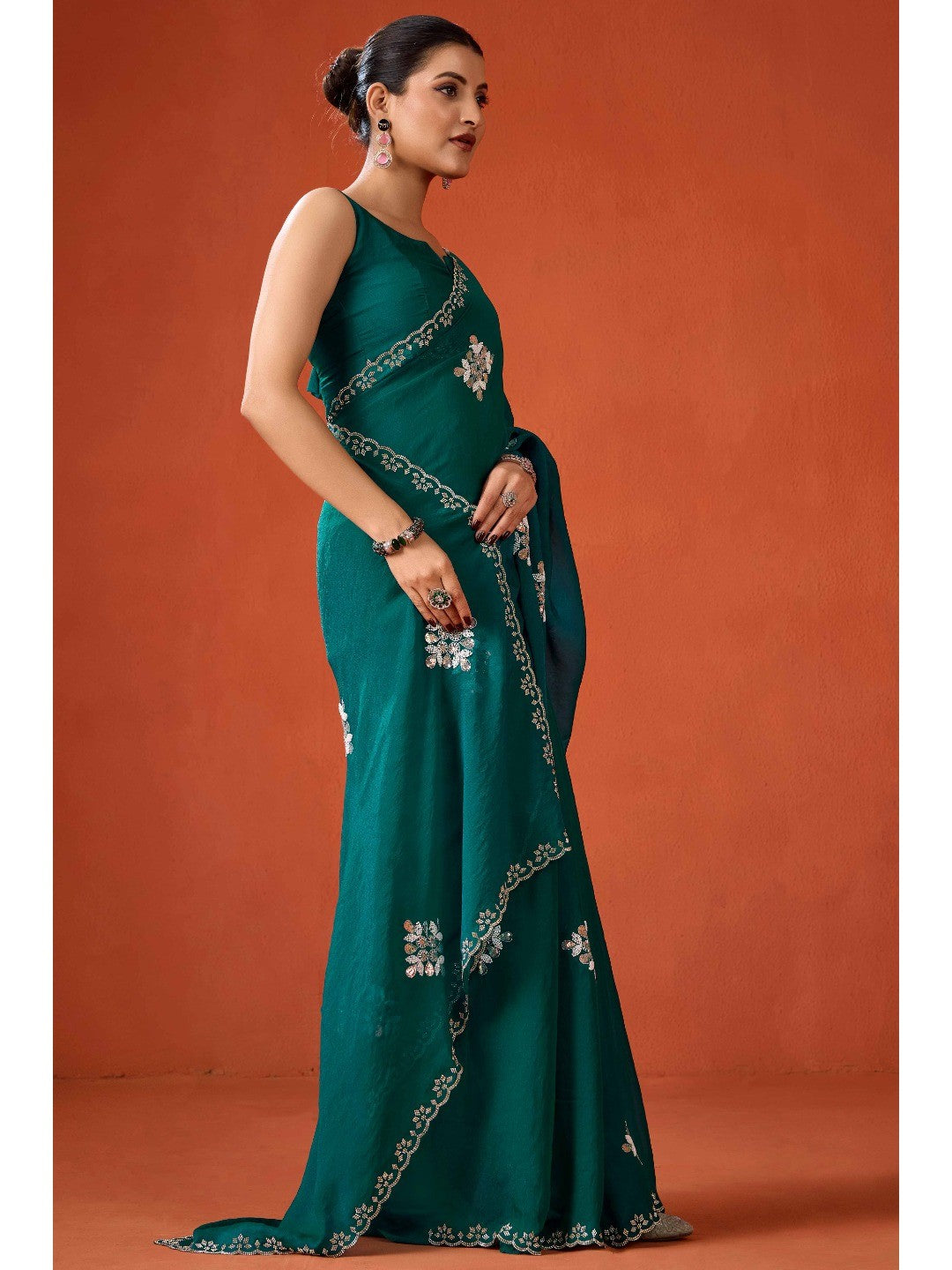 Graceful Teal Green Georgette Silk Saree Adorned with Floral Embellishments - Image 4