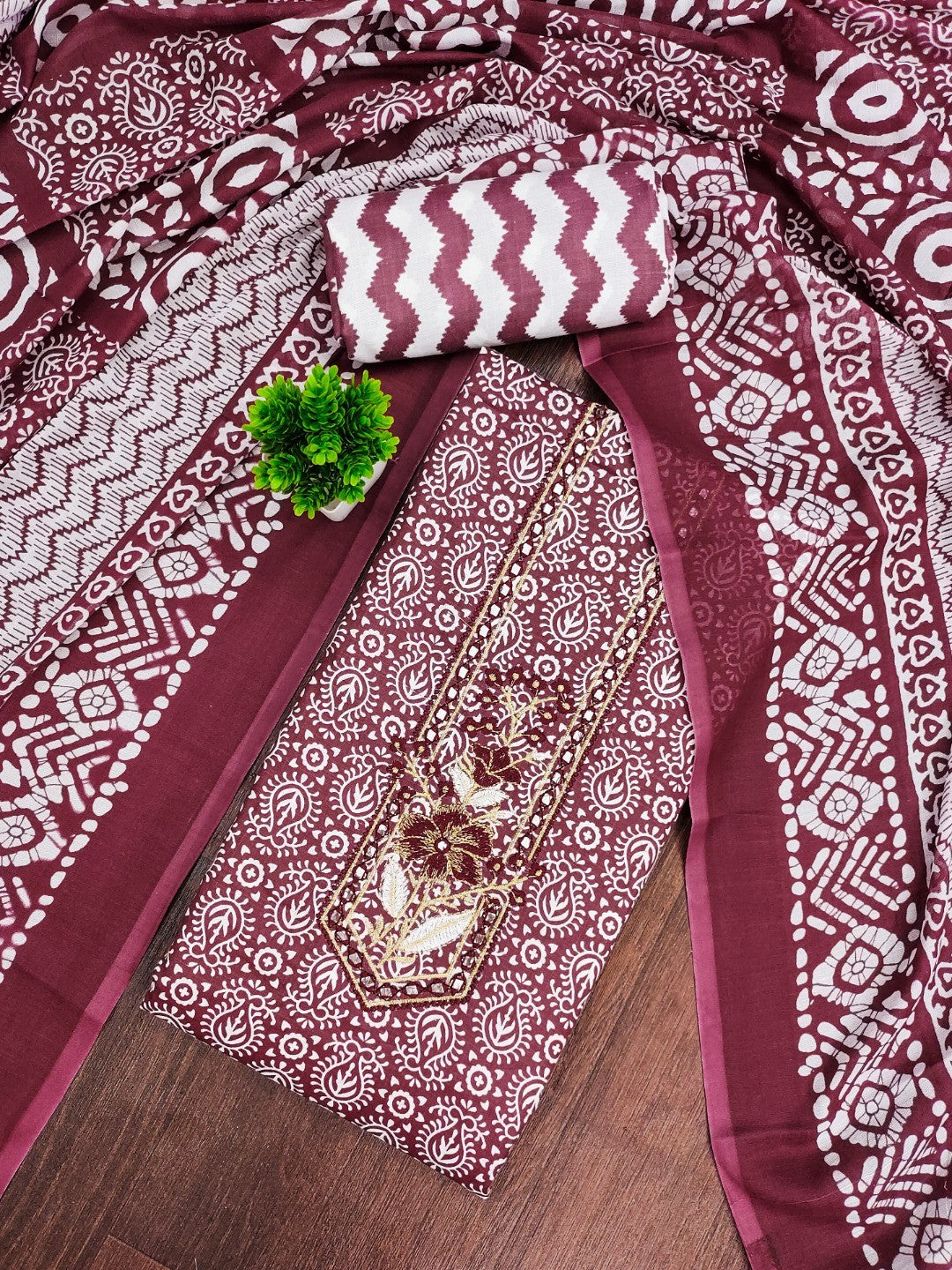 Classic Wine Printed Cotton Blend Dress Material Highlighted With Delicate Floral Embroidery On Neck - Image 1