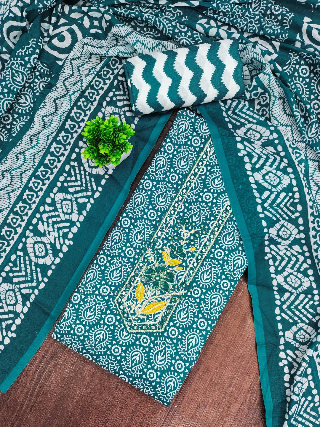 Classic Teal Printed Cotton Blend Dress Material Highlighted With Delicate Floral Embroidery On Neck - Image 1