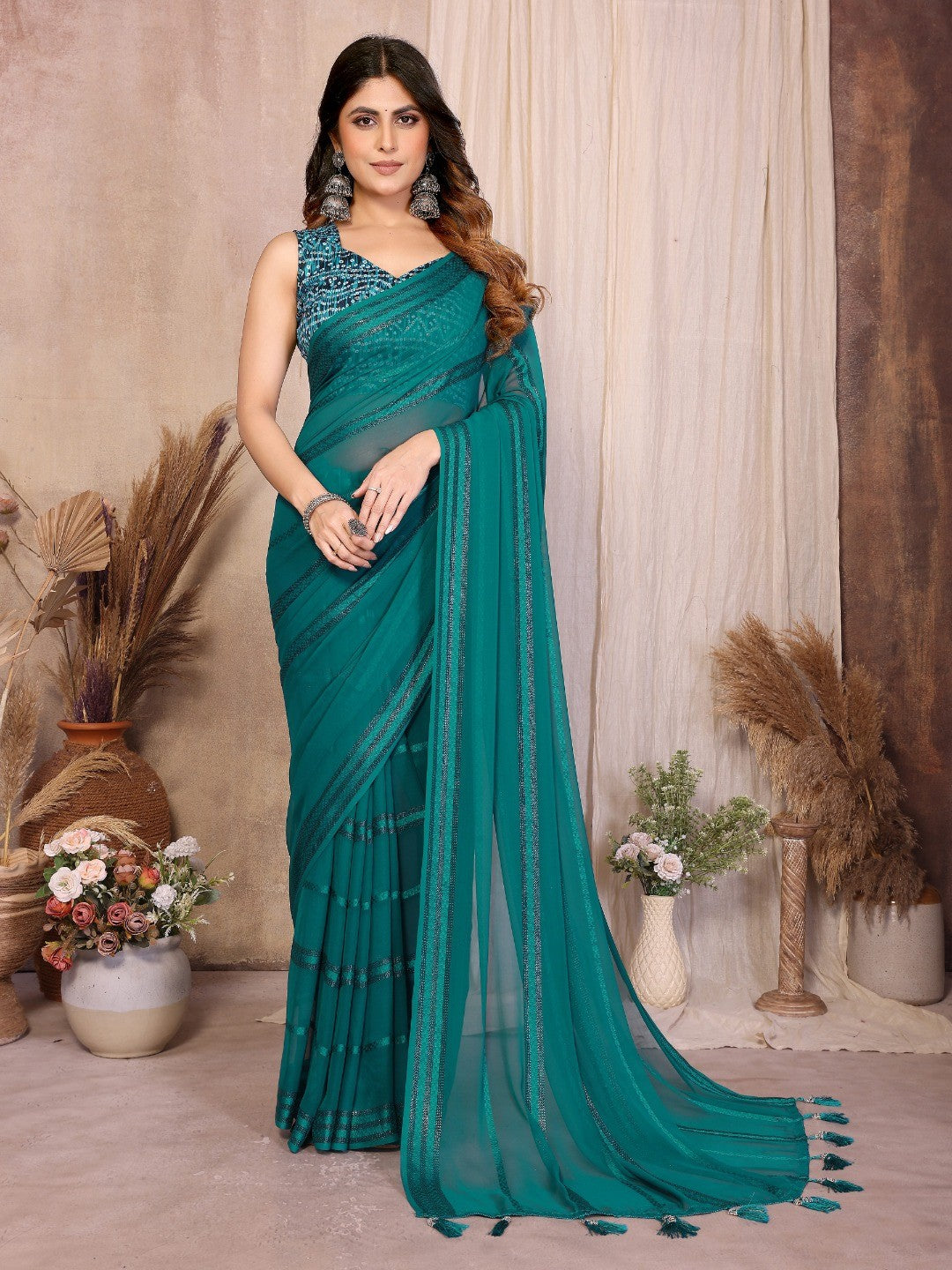Elegant Teal Zari Striped Weaving Georgette Saree Highlighted With Tassel Pallu - Image 1