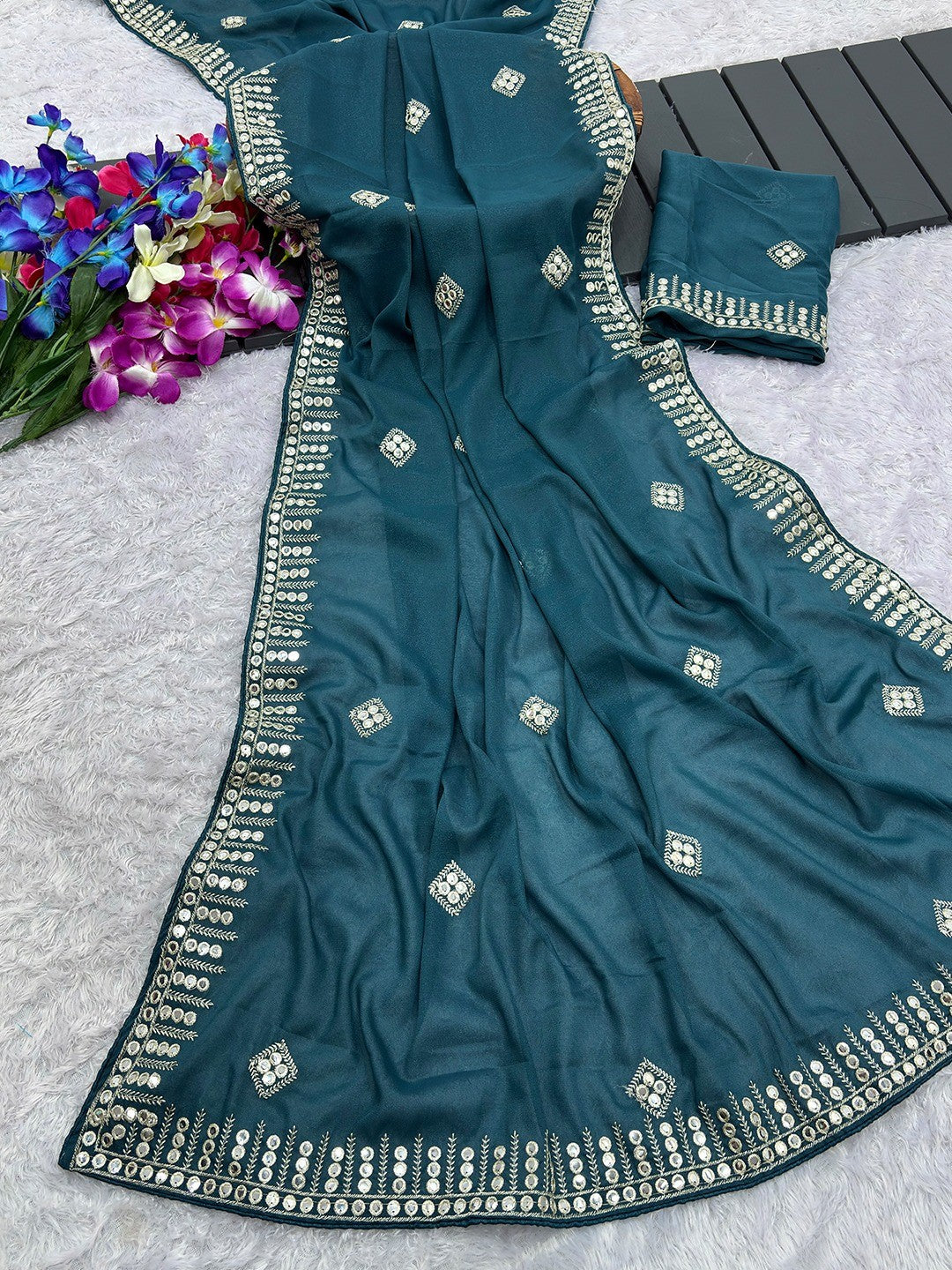 Charming Teal Blue Georgette Saree With Delicate Sequins Embroidery & A Beautiful Border - Image 1