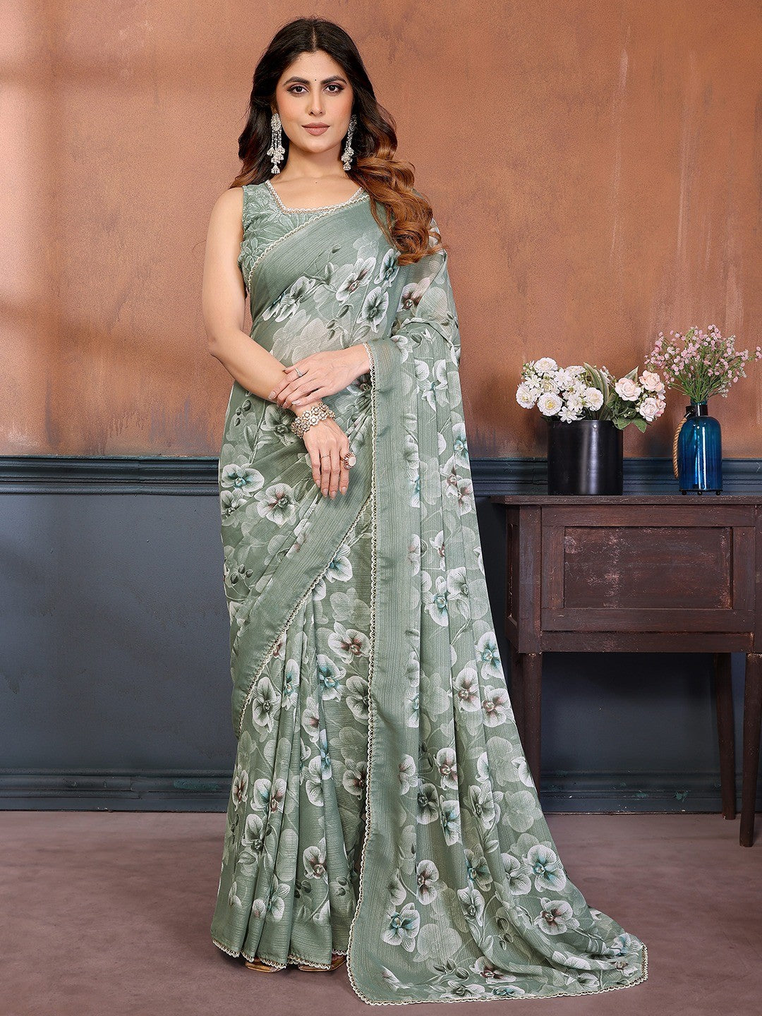 Elegant Green Floral Printed Georgette Saree Enhanced With Delicate Lace Border Work - Image 1