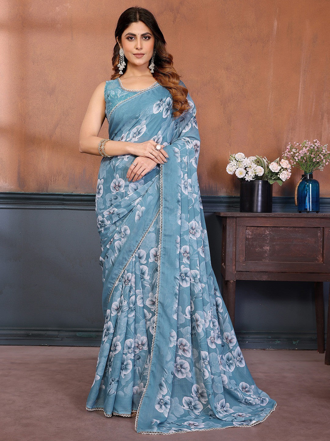 Elegant Sky Blue Floral Printed Georgette Saree Enhanced With Delicate Lace Border Work - Image 1
