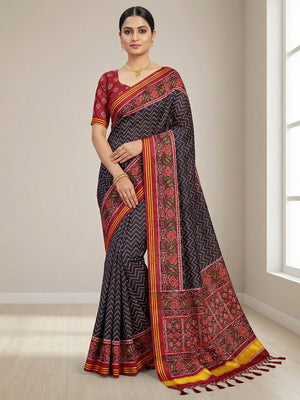 Traditional Black Patola Print Handloom Silk Saree with Pallu Tassel Detailing - Image 1