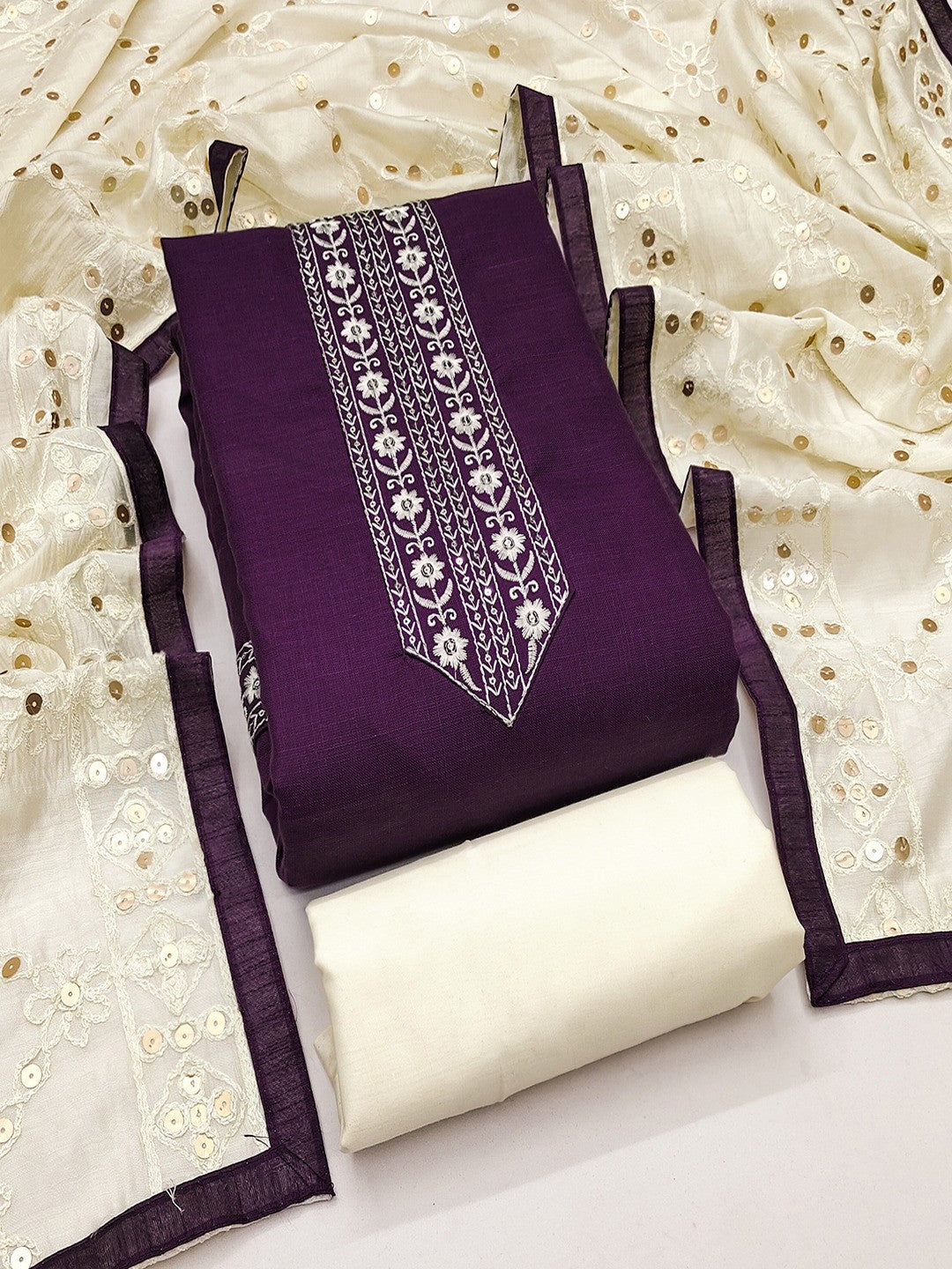 Elegant Purple Cotton Blend Dress Material Adorned With Floral Embroidery & Delicate Sequins Work - Image 1