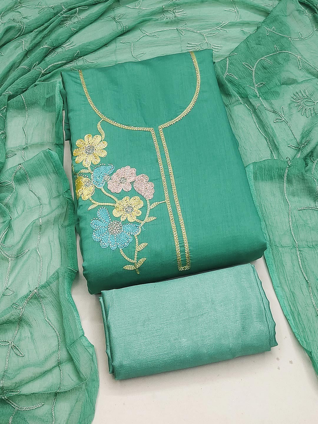 Graceful Turquoise Floral Embroidered Roman Art Silk Dress Material Adorned With Swarovski Work - Image 1
