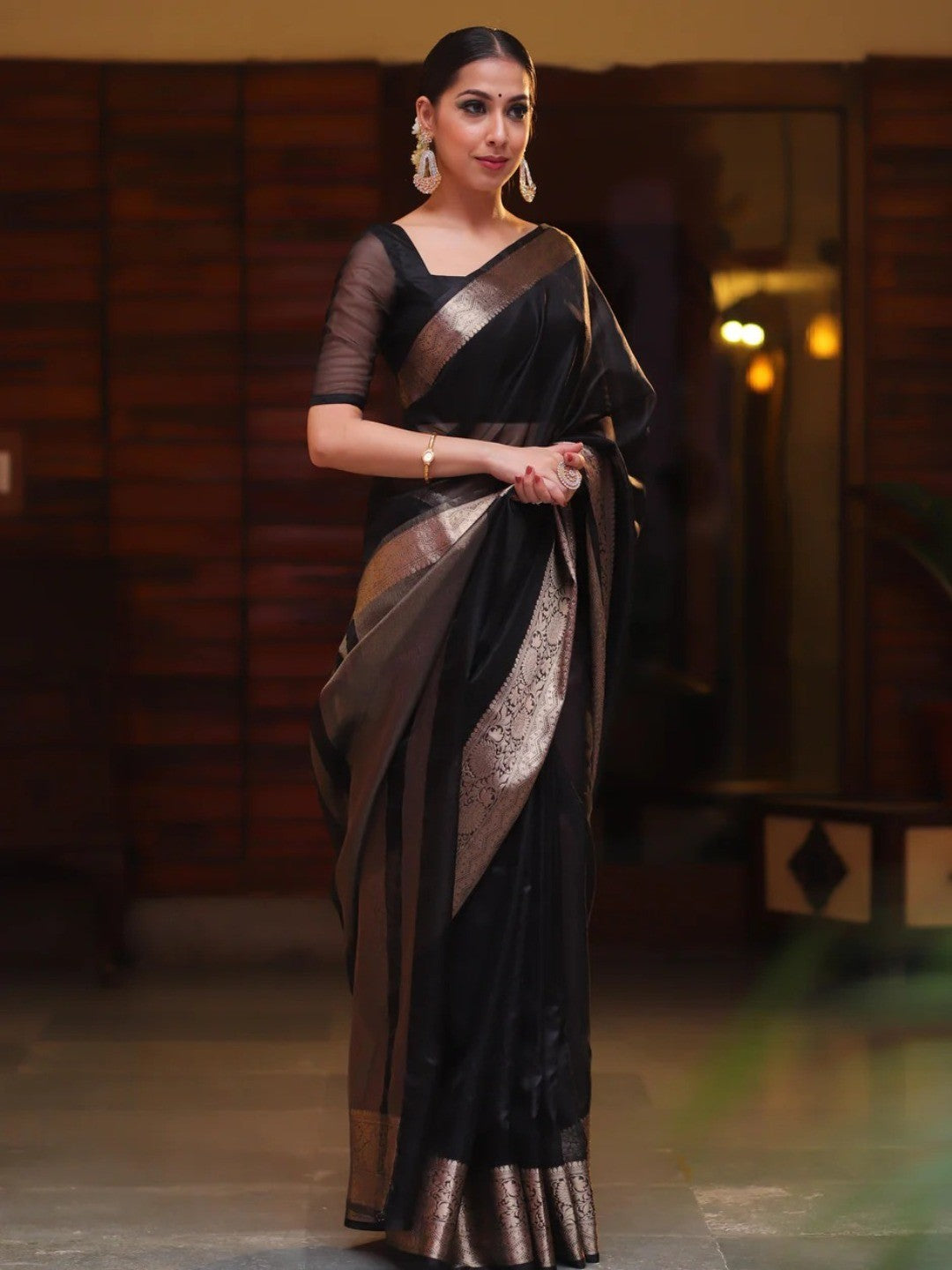 Classic Black Solid Organza Saree Featuring Floral Golden Zari Weaving Border - Image 1