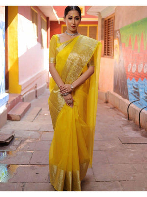 Classic Yellow Solid Organza Saree Featuring Floral Golden Zari Weaving Border - Image 1