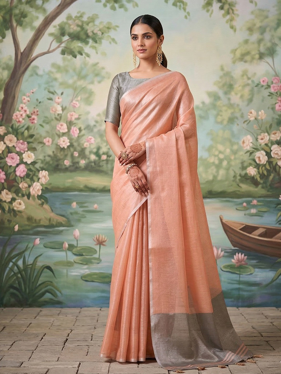 Modern Peach Tissue Saree with Elegant Grey Border and Stylish Tassels - Image 1