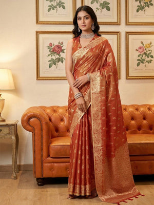 Elegant Rust Paisley & Floral Zari Weaving Tissue Saree With Tassel Pallu - Image 1
