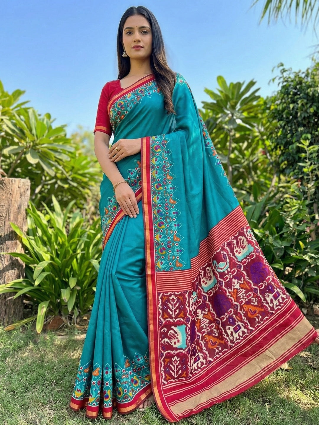 Teal Viscose Saree with Ikkat Printed Border and Graceful Feminine Appeal - Image 1
