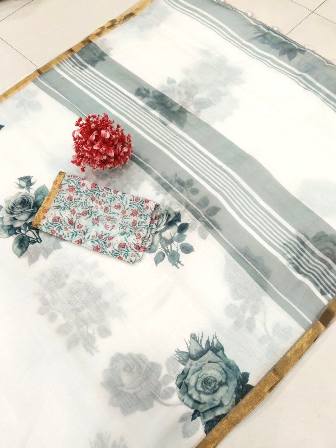 Elegant White Linen Saree with Floral Print and Golden Border - Image 2