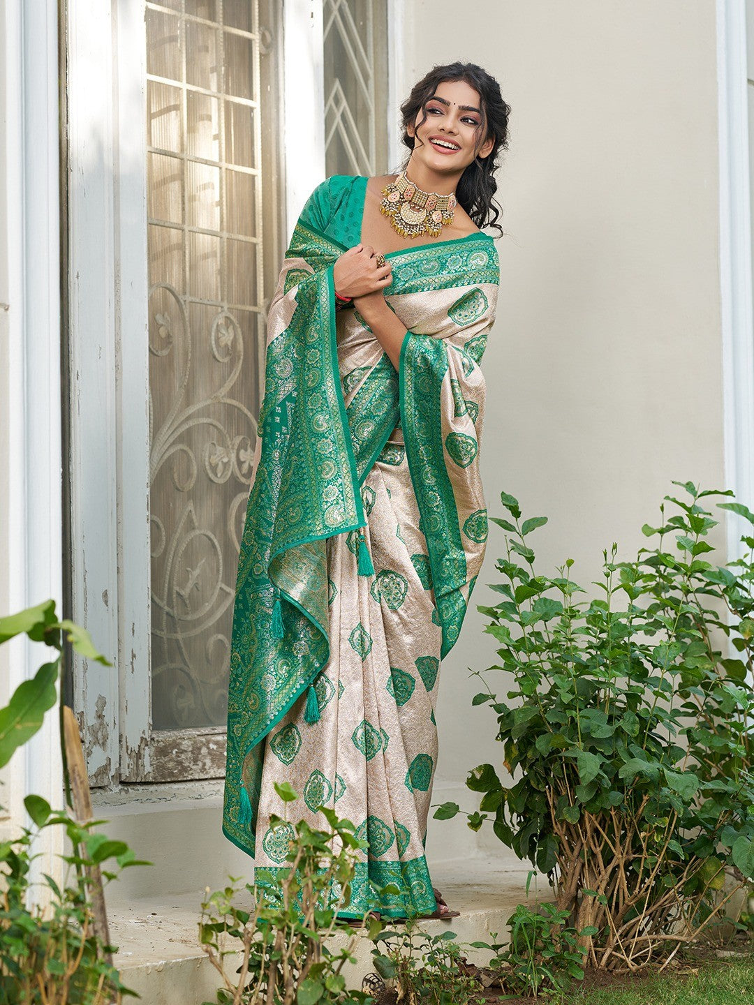 Graceful Cream & Turquoise Floral Weaving Silk Blend Saree Enhanced With Designer Tassel Pallu - Image 5