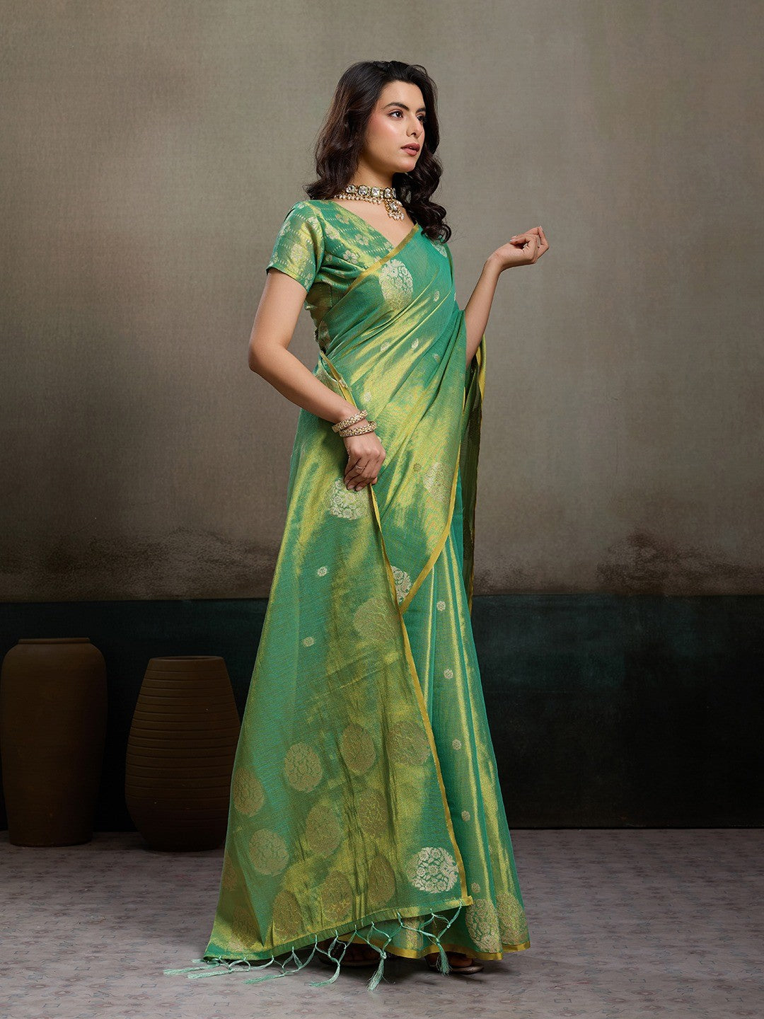 Stylish Green Tissue Saree with Fine Woven Floral Patterns and Glossy Finish - Image 2
