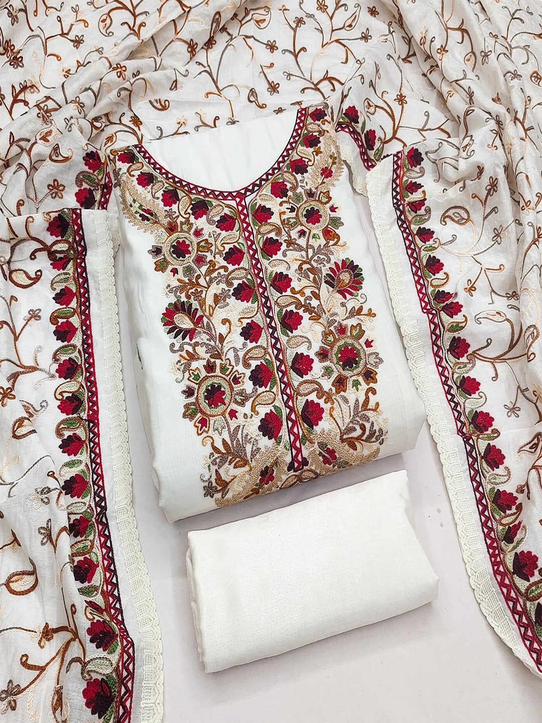 Ethnic Offwhite Roman Art Silk Dress Material Highlighted With Floral & Paisley Thread Embroidery - Image 1