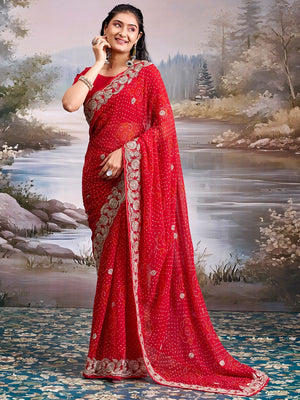 Graceful Red Bandhani Print Georgette Saree Highlighted With Floral Embroidery Work Border - Image 1