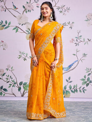 Graceful Mustard Bandhani Print Georgette Saree Highlighted With Floral Embroidery Work Border - Image 1