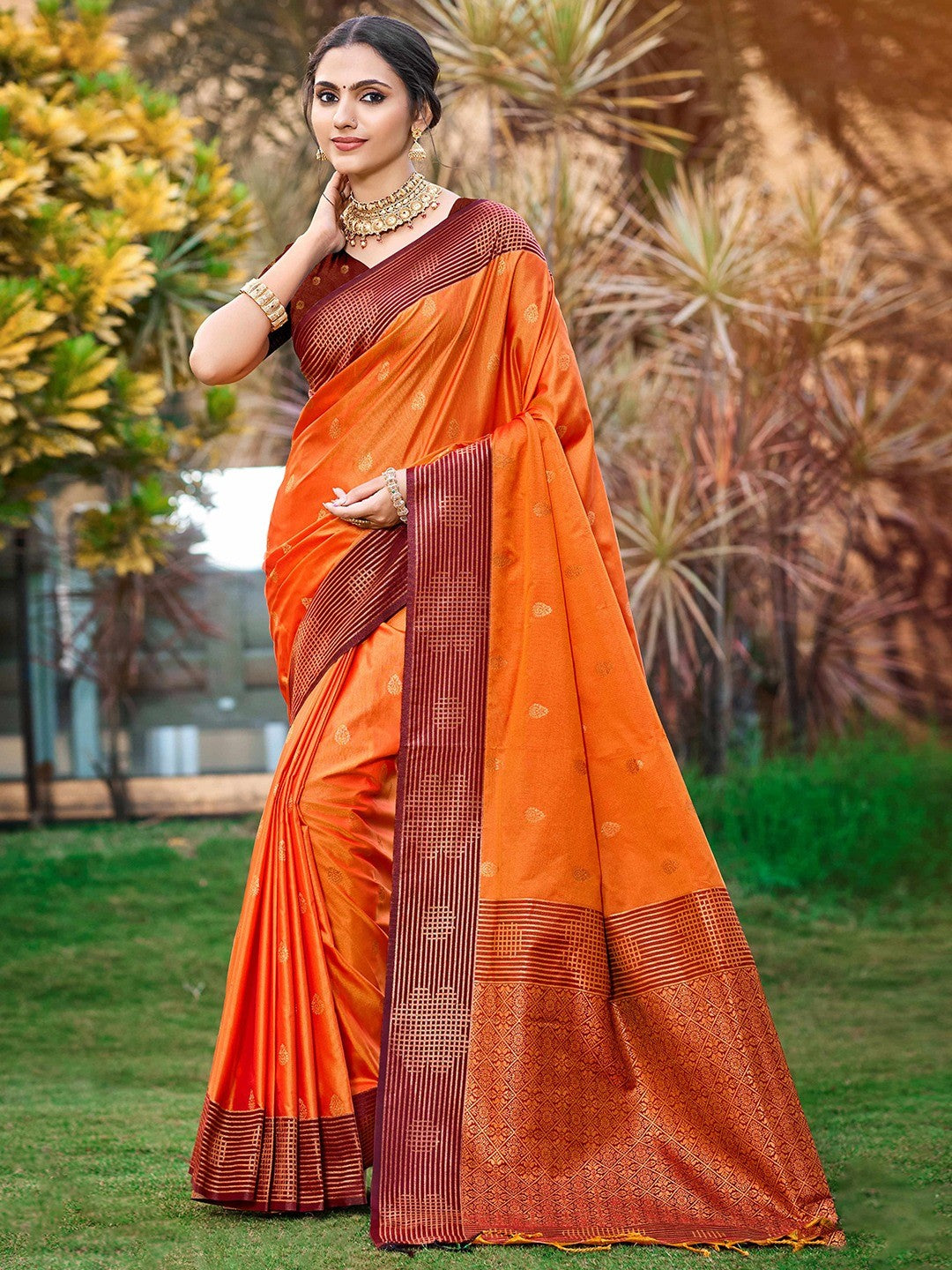 Graceful Orange Zari Woven Silk Blend Saree With Floral Motif Detailing & Elegant Tassels Pallu - Image 1