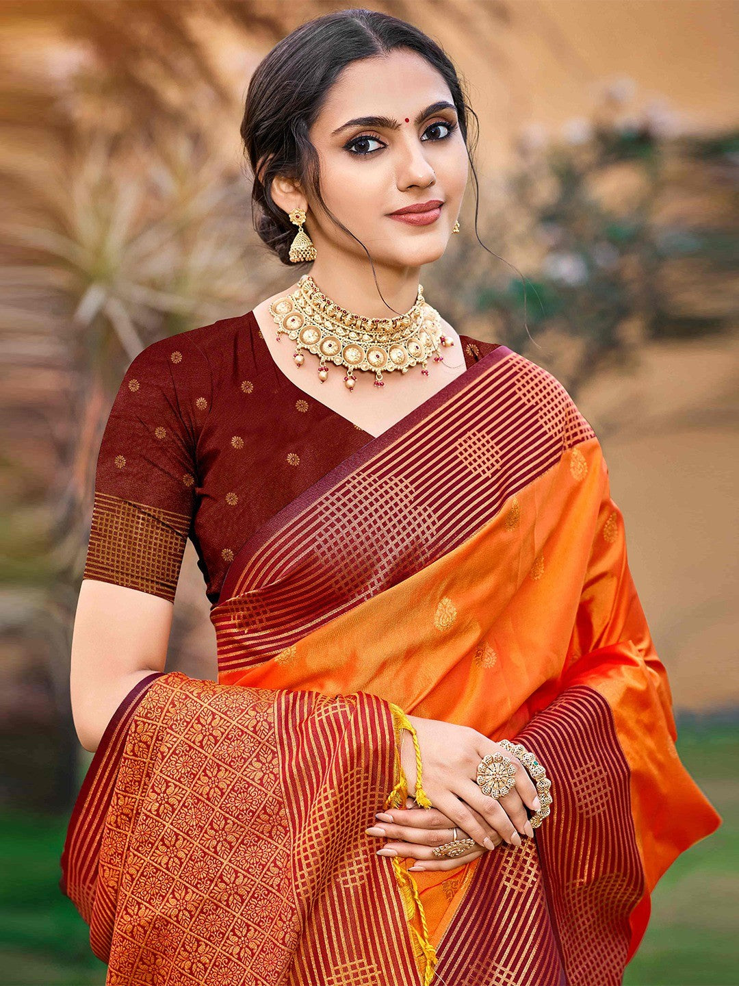 Graceful Orange Zari Woven Silk Blend Saree With Floral Motif Detailing & Elegant Tassels Pallu - Image 4