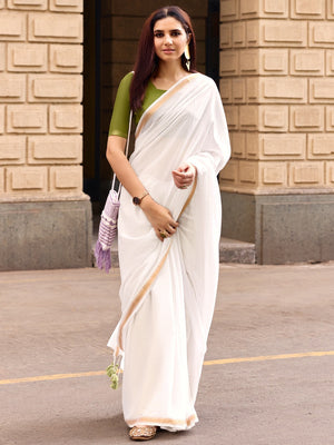 Charming White Solid Mulmul Cotton Saree Highlighted By Zari Weaving Border & Tassel Pallu - Image 1