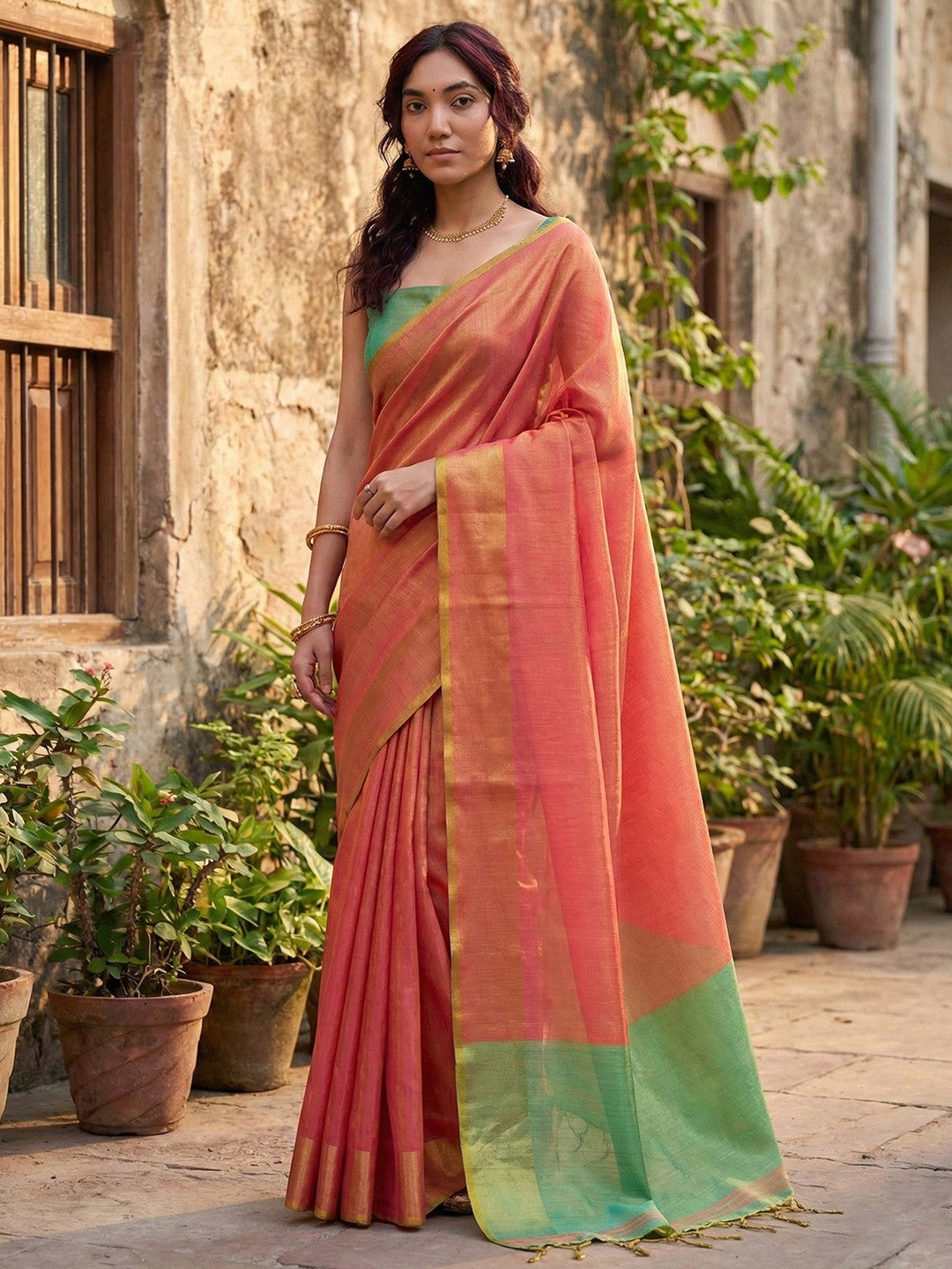 Classic Pink Solid Tissue Silk Saree Featuring Intricate Zari Weaving & Tassel Pallu - Image 1