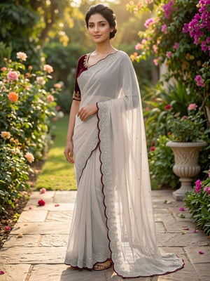 Luxurious Cream Georgette Saree with Sequins Butti and Scalloped Border - Image 1