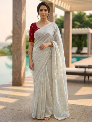Elegant Cream Organza Satin Silk Saree Featuring Floral Butti Sequins Embroidery & Tassel Pallu - Image 1