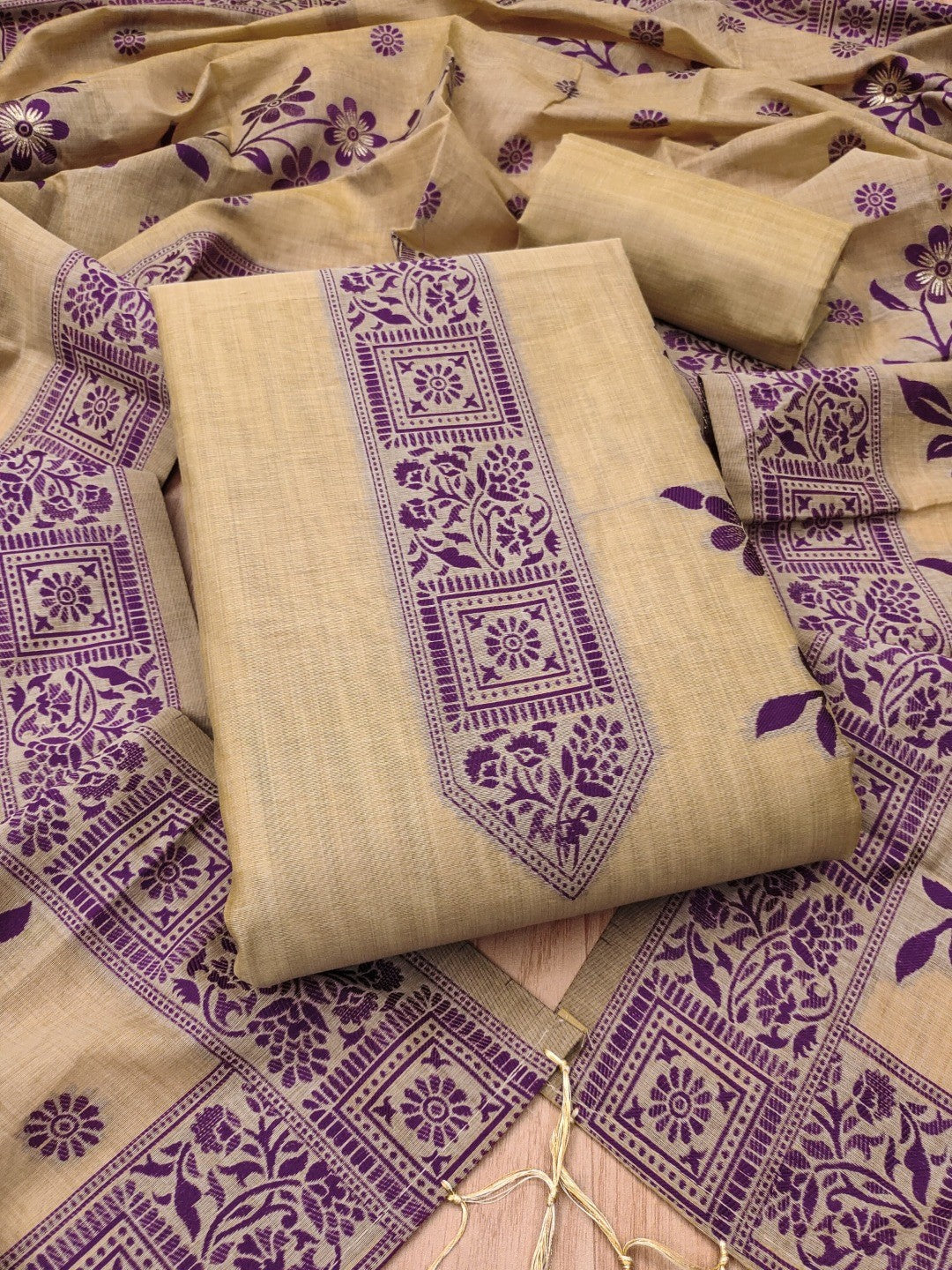Designer Chikoo Muga Cotton Blend Jamdani Dress Material With Floral Zari Weaving - Image 1