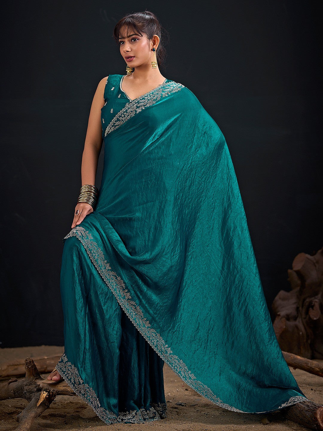 Glamorous Teal Solid Satin Silk Saree Adorned With Floral Stone Embellished Border - Image 1