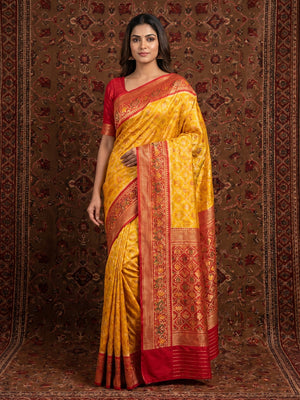 Flaunt Yellow Colored Festive Wear Woven Patola Silk Saree - Image 1