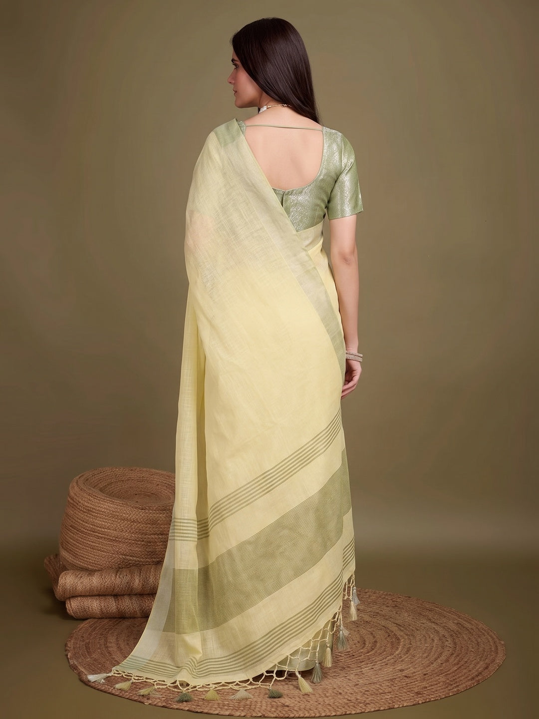 Sophisticated Yellow Linen Saree Featuring Intricate Zari Weaving & Tassel Accents - Image 2