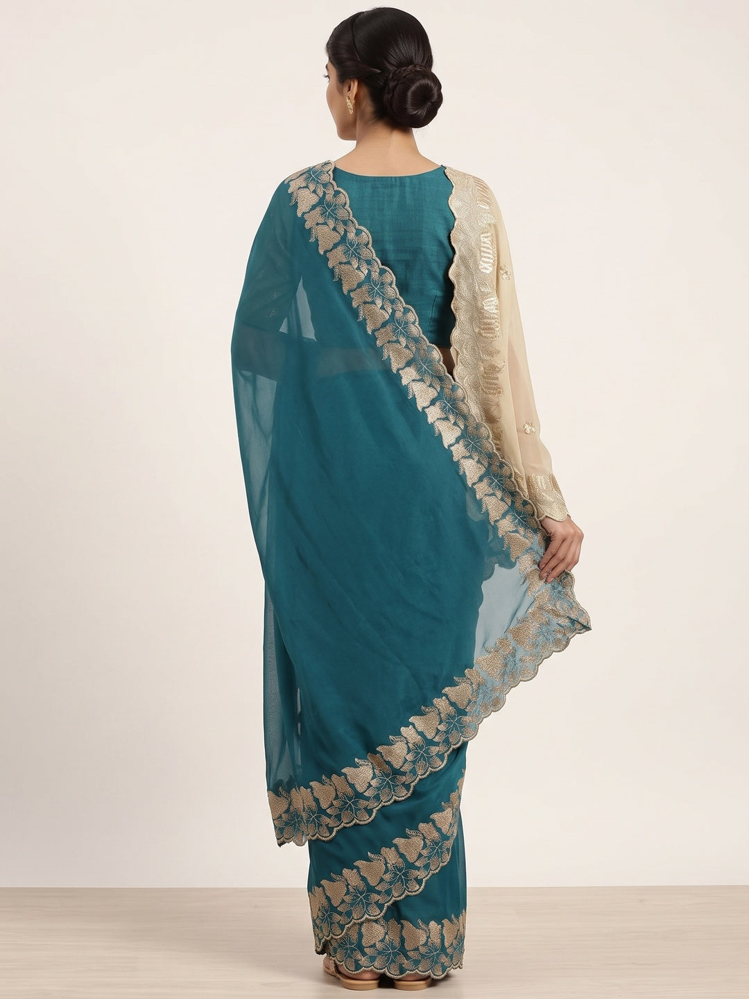 Elegant Teal Solid Georgette Saree Highlighted With A Delicate Floral Embroidered Border - Image 6