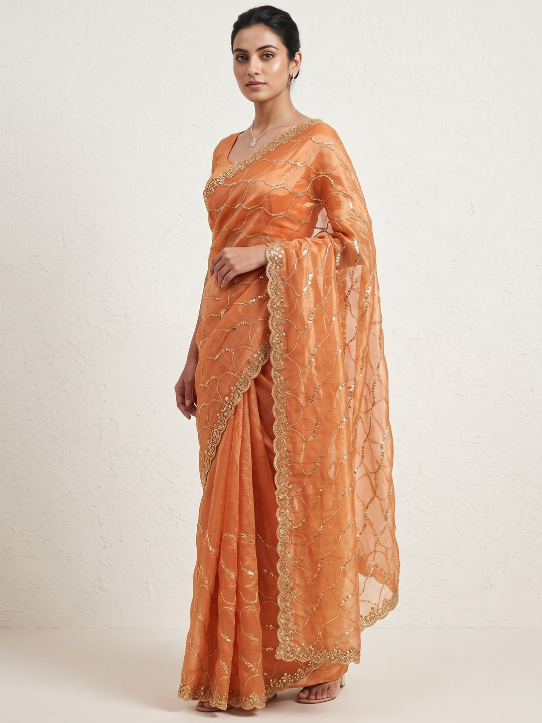 Orange Partywear Organza Chiffon Silk Saree Highlighted with Fine Sequins Detailing - Image 1