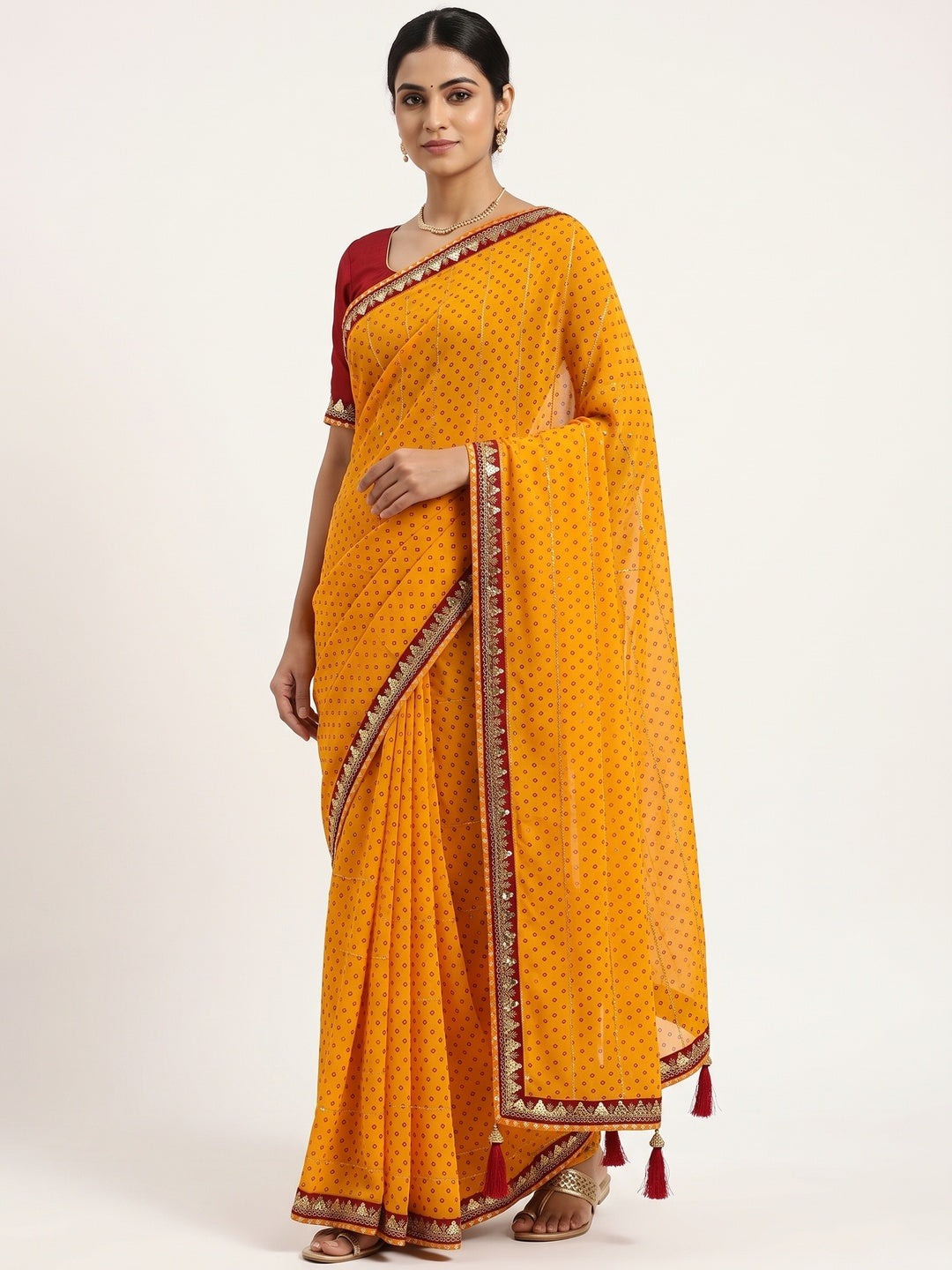 Charming Mustard Bandhani Printed Georgette Saree With Glittering Sequins & Zari Border - Image 1